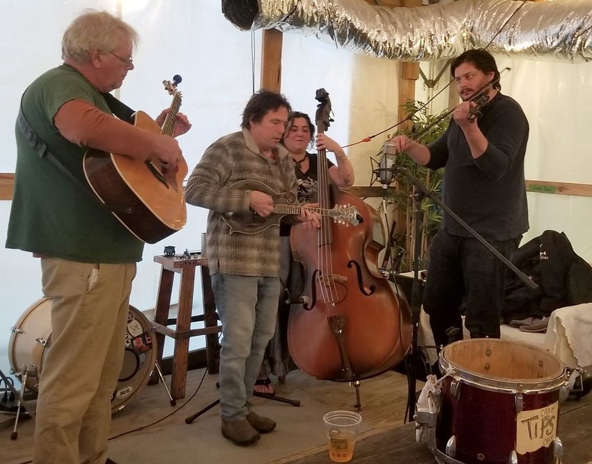 Members of Four EZ Payments (from left Bob Dickinson, Rob Dunbar, Lucy Van Arsdale and Caleb Cressman) playing at Cisco Brewers Wednesday.