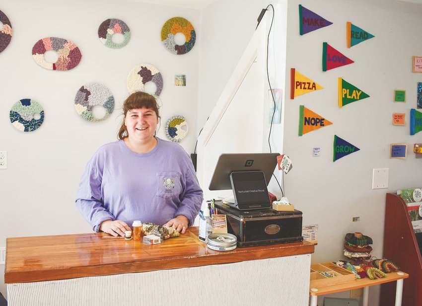 Emma Young behind the counter of her Hanabea Lane craft store, Nantucket Creative Reuse.
