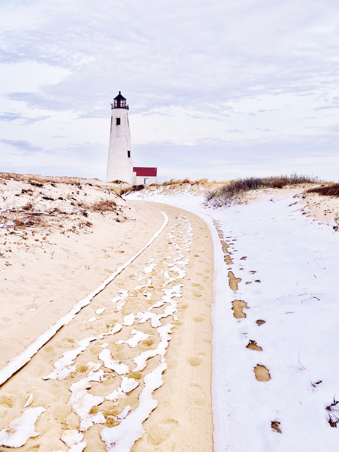 Snow melts from the track leading to Great Point Light Feb. 13.