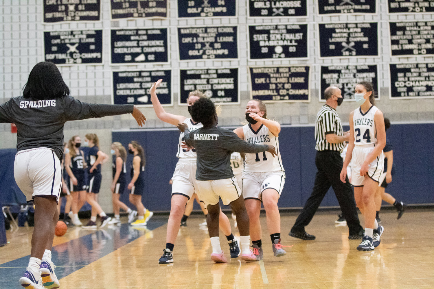 Lady Whalers celebrate first win of season