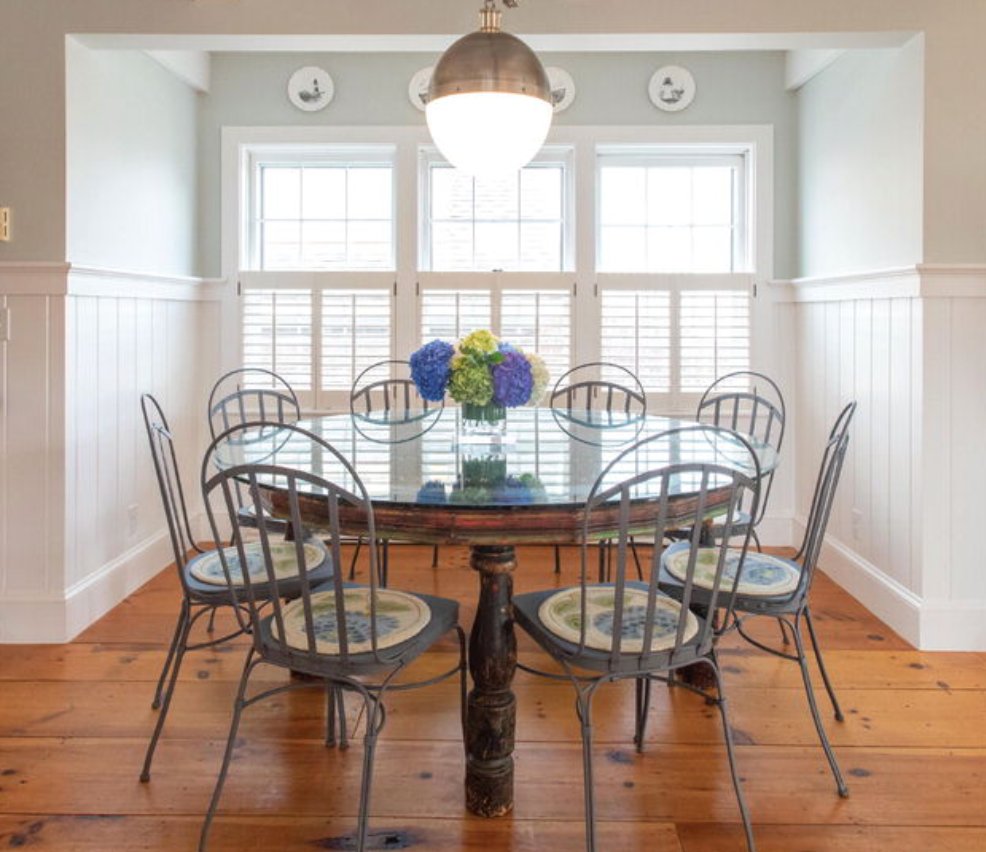 The second-floor dining room, located just off the kitchen, has wood floors and is filled with natural light.