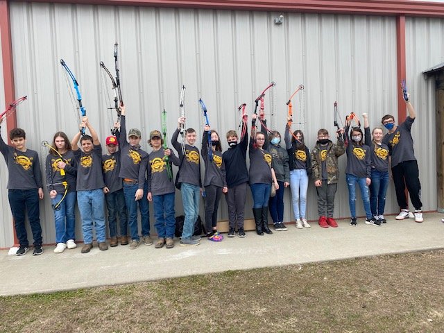 Pleasant Hope&rsquo;s archery team Pirates proudly raise their bows during the 2020-21 school year.