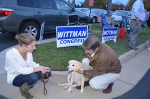Wittman meets with resident Laura Beggs and her labrador. 