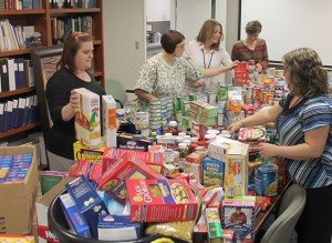 Volunteers sort through donations collected by the Blue Ridge Orthapeadic Foundation