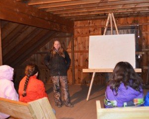 Students learn their science lessons in a loft classroom. 