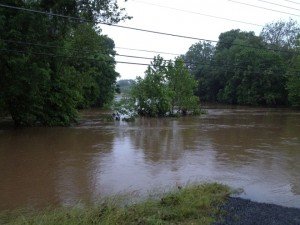 Photo of Broad Run flooded along Linton Hall Road and Sudley Manor Drive during a previous storm.  