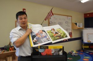 Owner Tom Cheng shows the National Geographic science text book which the Bristow location was chosen to use as part of a pilot program. 