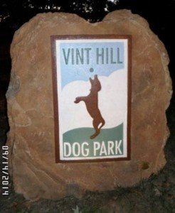 Sign welcomes dogs and their owners to the Vint Hill Dog Park. 