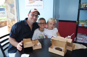 Mike Dempsey, his son Owen, and daughter, Brynn, were excited to enjoy their first Duck Donuts donut. 