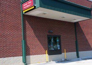 Someone threw a rock at the Walgreens pharmacy drive-thru window early Saturday morning.