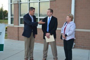 Gainesville District Supervisor Pete Candland speaks with Chairman Corey Stewart and Jeanie Heflin outside Piney Branch Elementary School. 