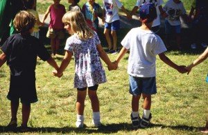Children Holding Hands on School Playground