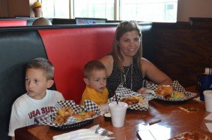 Diane Regalbuto of Loudoun County enjoys a Velocity burger with her sons Joe and Paul. 