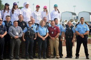 Culinary students and first responders stand together. 