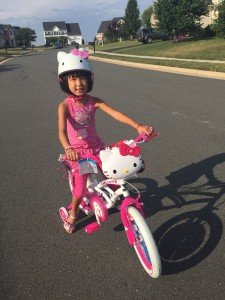 Lily training for the 2016 5K over the summer on her new Hello Kitty bicycle. 