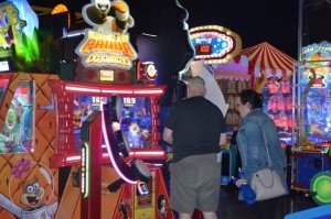 Couple plays an arcade game inspired by Kung-Fu Panda. 