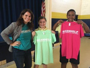 Kim Karr of #ICANHELP gives t-shirts to LHS students. 