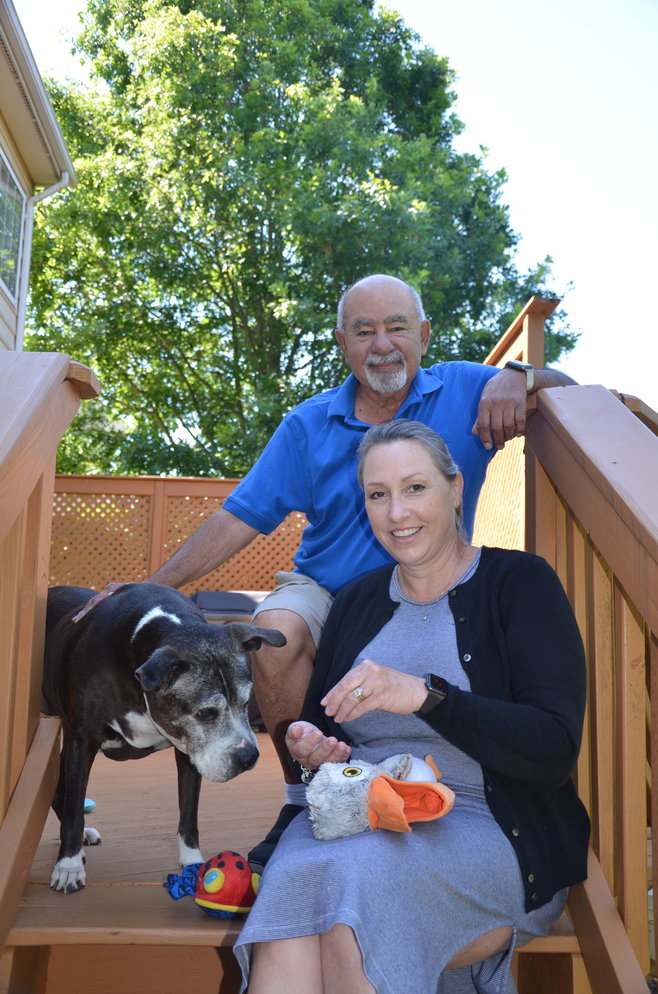 Taylor Sharp with her foster father Leonard Garduno and her foster dog Missy at her home in Bristow.