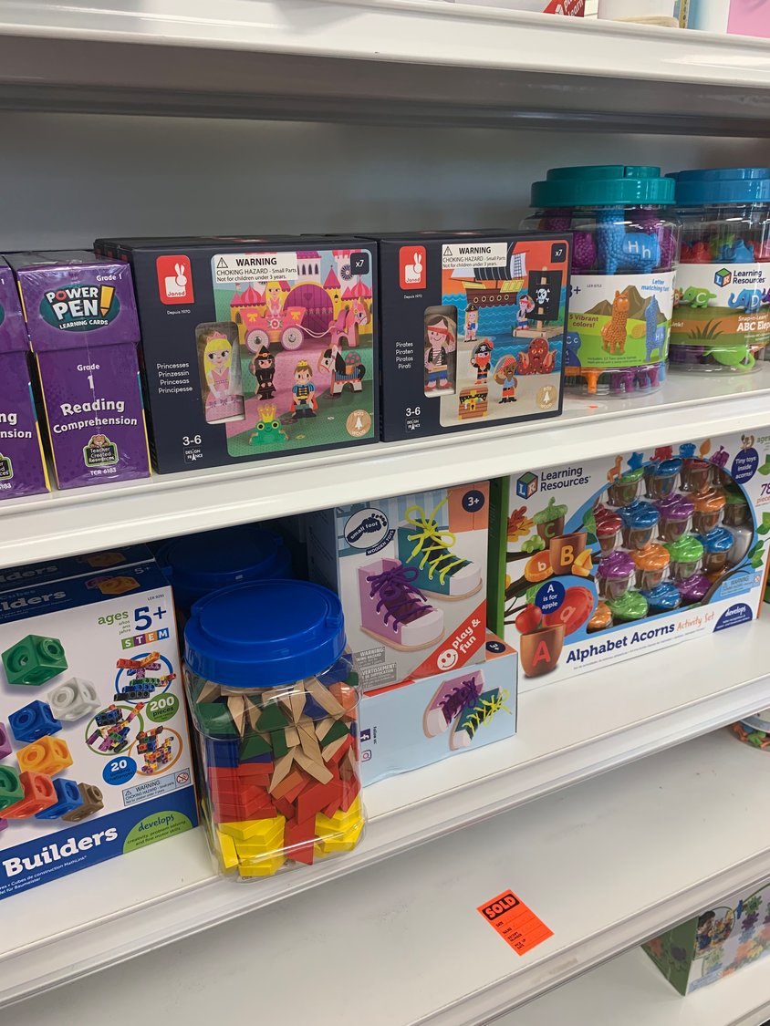 shelves of learning games and activities