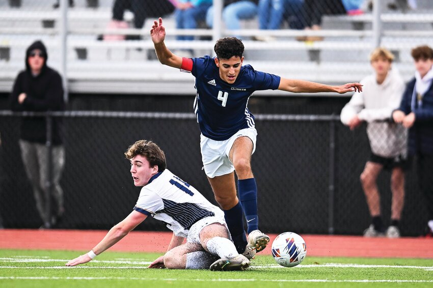 Council Rock North’s Ari Pollack gets by a sliding tackle attempt from La Salle’s Finn Murray.