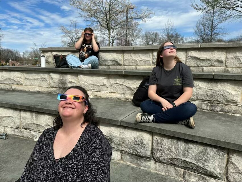 Donning special glasses, skygazers at Delaware Valley University watch the solar eclipse Monday afternoon.