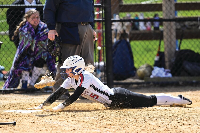 William Tennent’s Madison Pirolli crosses home plate behind her spike after scoring from first with the game-winning run in the sixth inning.