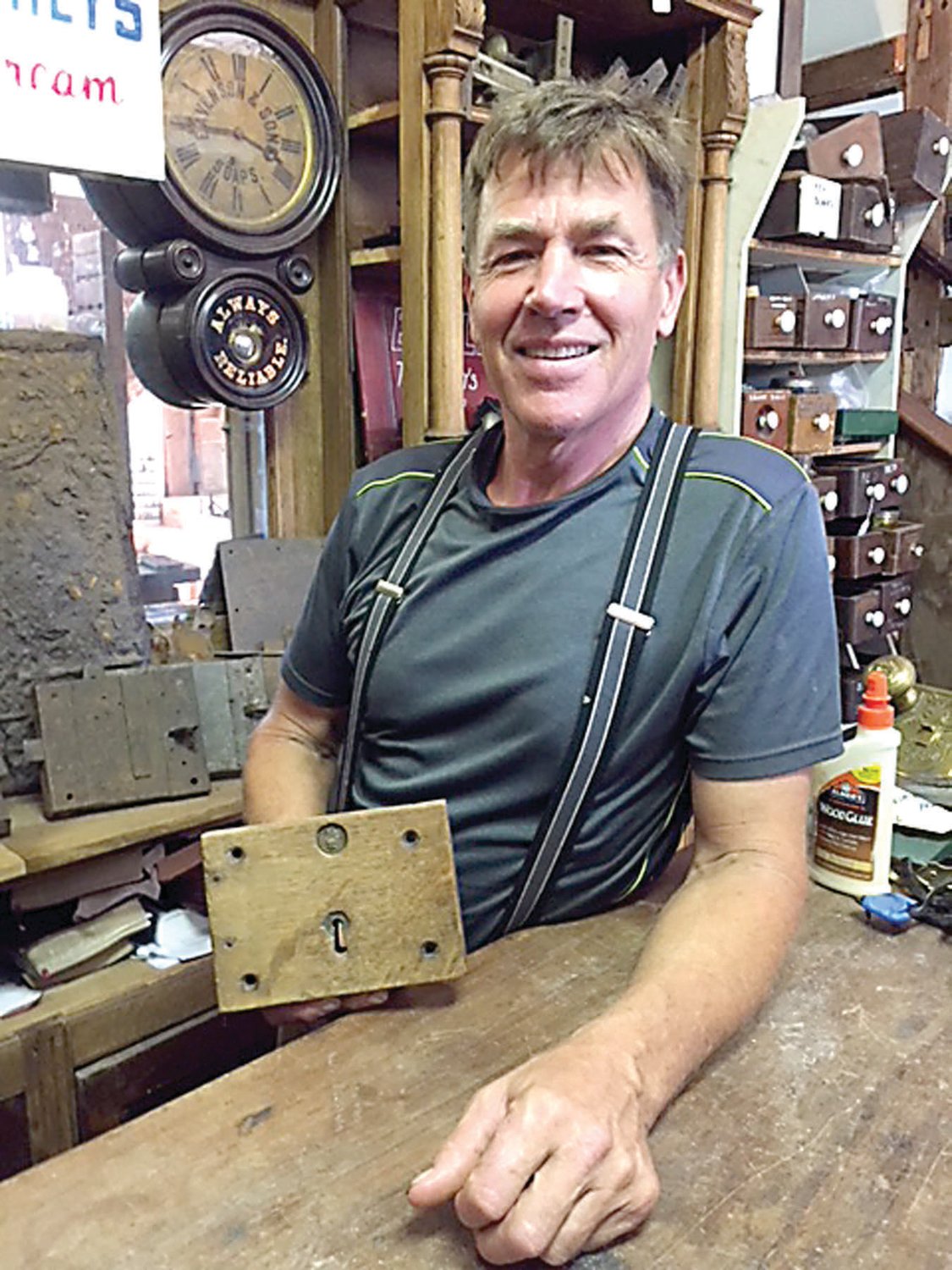 Wayne Rickert of Architectural Antiques in Bedminster displays a 17th century wooden lock.  Photograph by Kathryn Finegan Clark