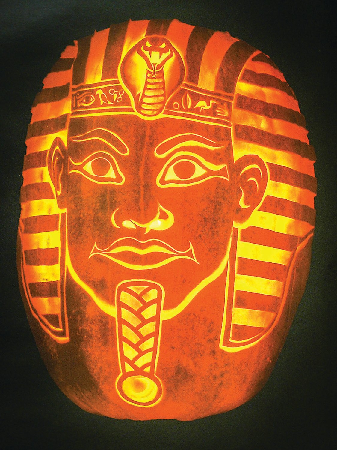 An elaborate pharaoh carved by Tomas Gonzales is a far cry from the basic design that is being jabbed and sawn out of pumpkins all across America each October.