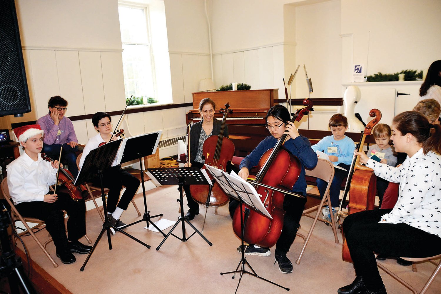 A young musicians orchestra at Newtown Friends Meeting is led by Debbie Watts, a music educator and member of the Meeting.
