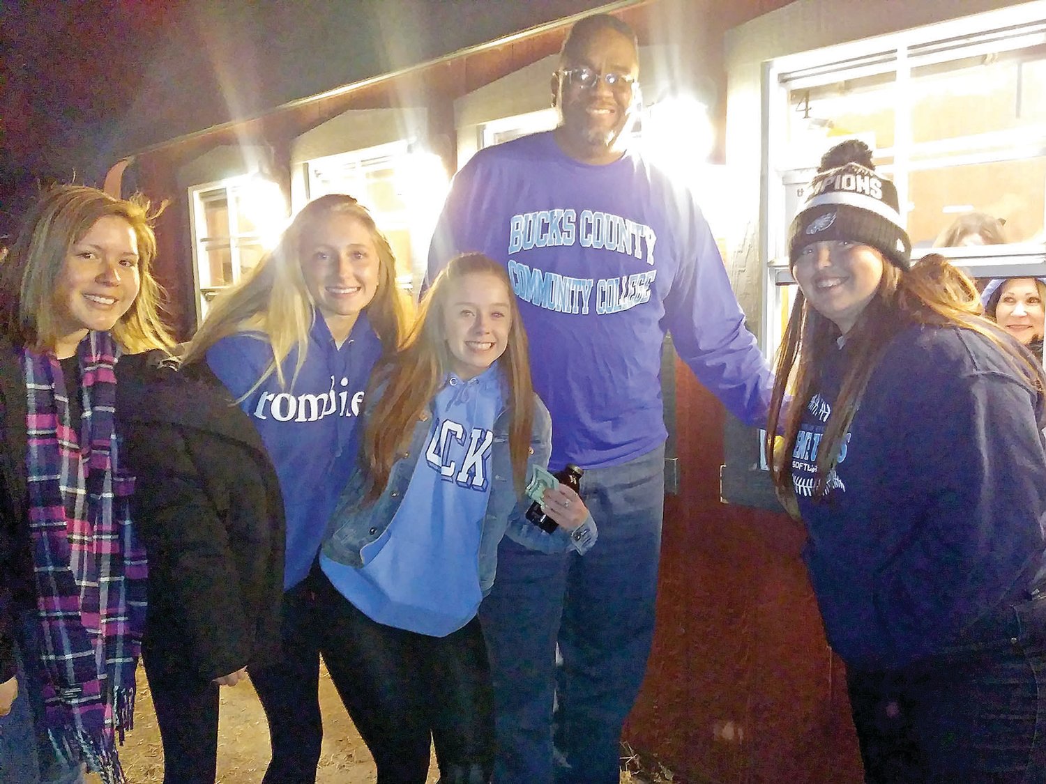 Bucks County Community College’s women’s basketball team recently donated several dozen canned good to support Shady Brook Farms’ food drive for Bucks County residents in need for the holidays. At the drop-off are, from left, players Camila Navarrete, Amanda Edson and Lauren Daley, head coach Andre Bright and player Sarah Dees.