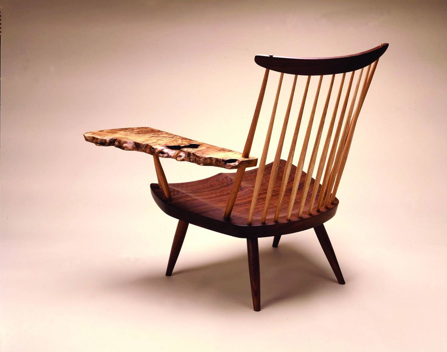George Nakashima designed this Lounge Chair with Myrtle Burl Arm ca. 1962. It was made in 1989 by George Nakashima Woodworkers.
