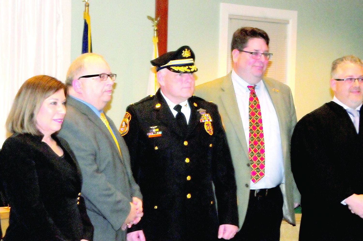 Newtown Township’s Board of Supervisors Vice Chair Linda Bobrin, Chair Phil Calabro, Police Chief John L. Hearn, board member Kyle Davis, and Magisterial Justice Michael Petrucci, who performed the swearing in Feb  27.  Photograph by Steve Sherman