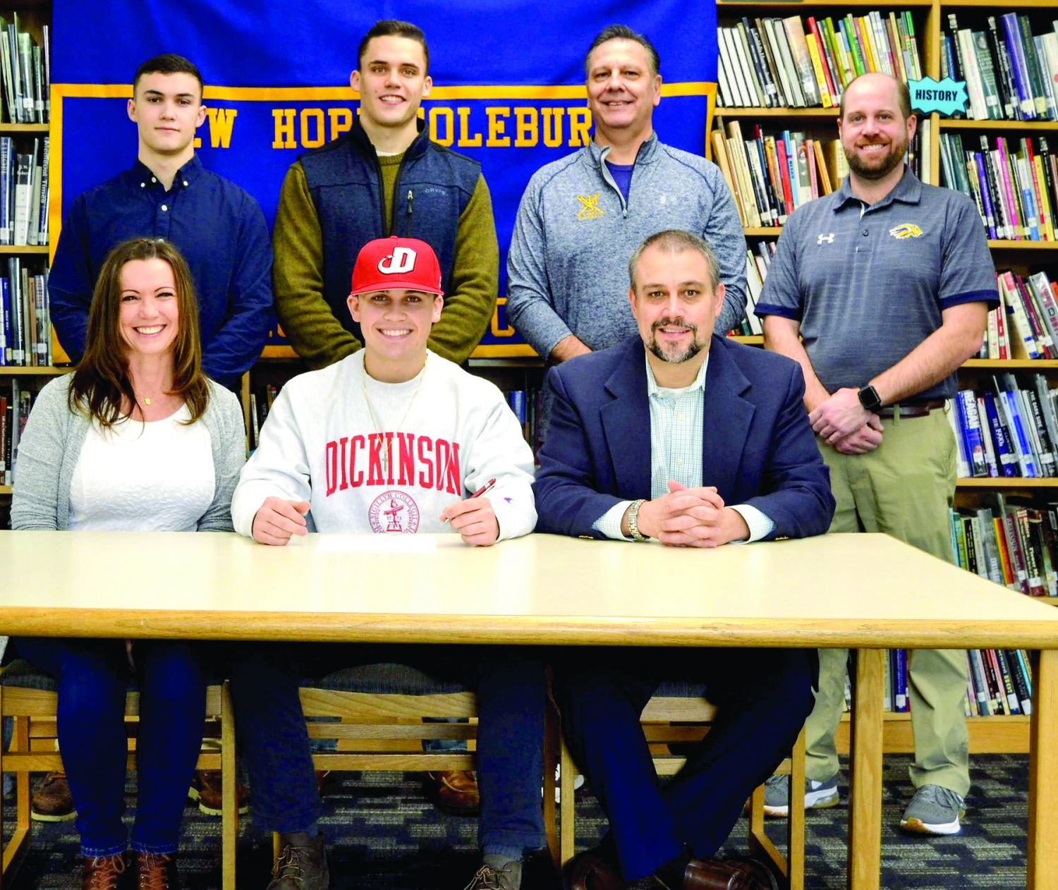 New Hope-Solebury baseball player Derek Smith, seated, center, recently signed his letter of intent to attend Dickinson College. Joining the senior at the signing ceremony are his family members, mother Sherry Smith, father Brian Smith, and brothers Kyle Smith and Brandon Smith; New Hope-Solebury baseball coach Tony Vlahovic and Assistant Athletic Director Kris Foulke.
