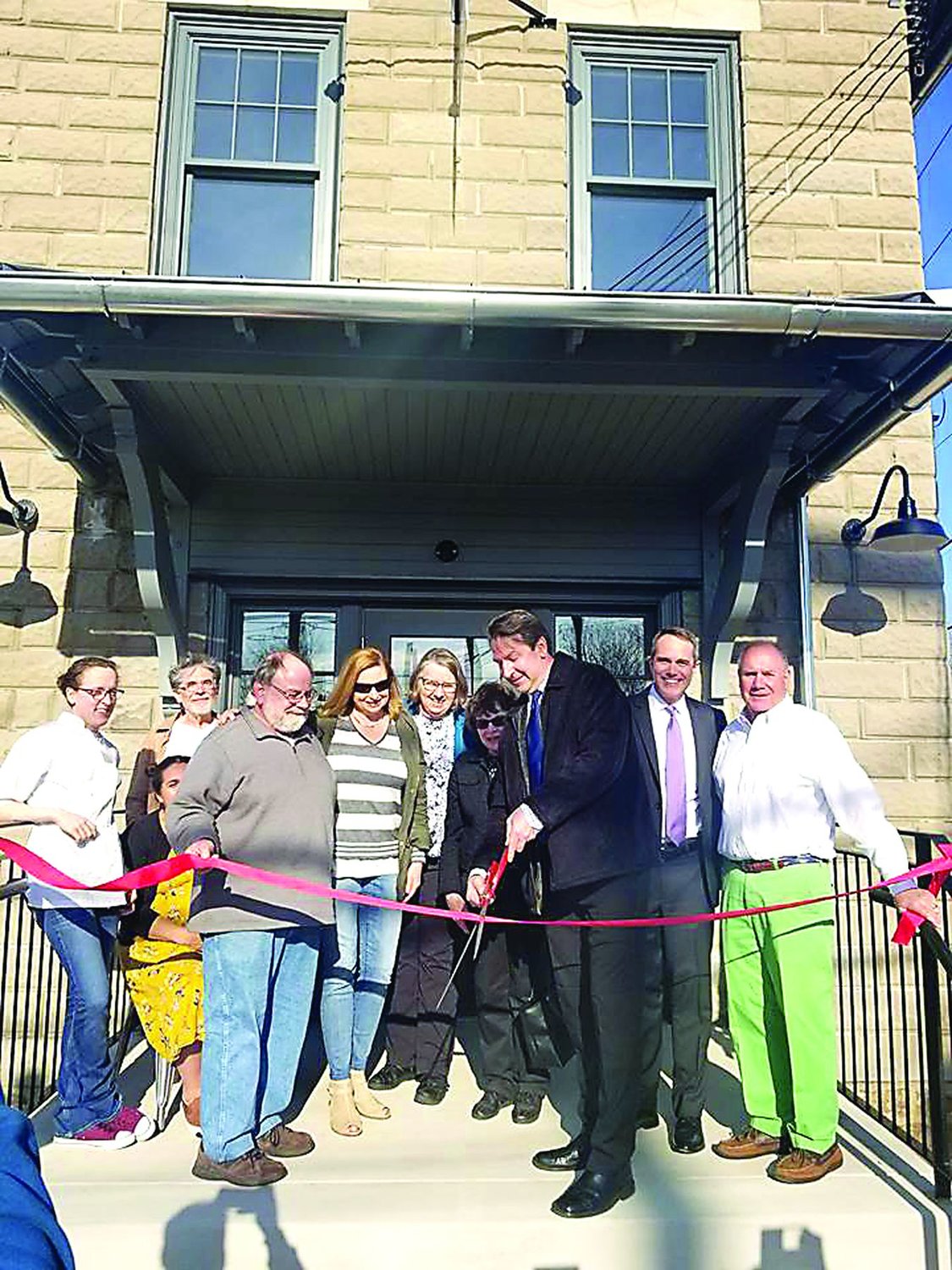 At the Ribbon Cutting at the new Owowcow Creamery in Chalfont Thursday, April 4, are from left, Amanda Cox, executive chef Owowcow; seated, Shira Wade, general manager Owowcow; John Fezzouglio, owner Owowcow; Chalfont Borough Council President John Engel, council members Tracey Bowen and Marilyn Jacobson, former Mayor Marilyn Becker, Mayor Brian Wallace, State Sen. Steve Santarsiero and Council Member John Abbott.