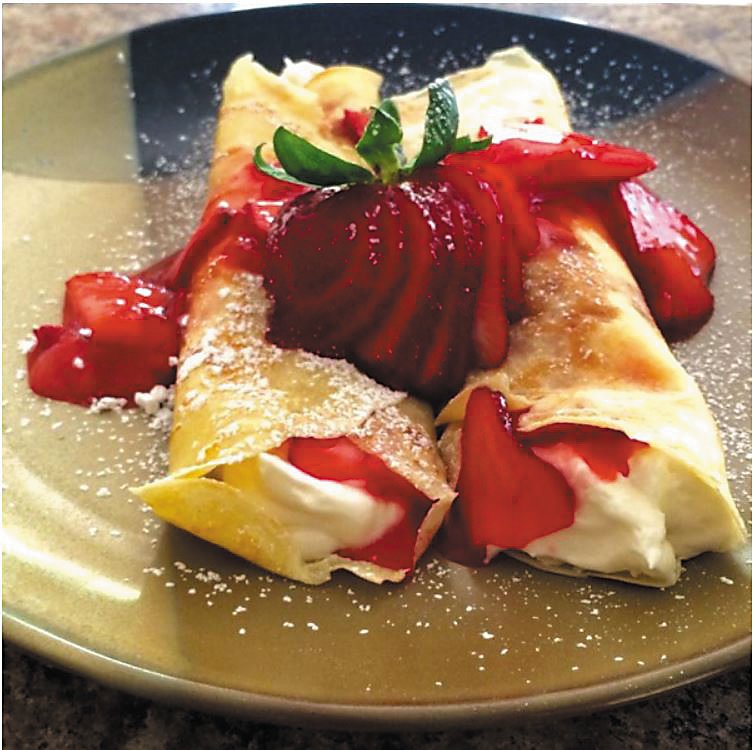 Creamy Strawberry Crepes can be a brunch or lunch dish on Mother’s Day, or a special dessert after a dinner at home.  Photograph by Allrecipes.com .