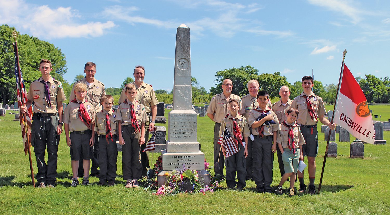 Troop 64 Boy Scouts participating in the Service of Remembrance included, front row from left, Rex Fowler, Zachary McNabb, Kenny Johnson, Jacob Konrad, Brighton Curcio, Ethan Broekema, Gus Clancy and Christian Wolf. Leaders participating included, back row from left, Wayne Fowler, Jeff Wolf, Juan Bravo, Ted Nichols (scoutmaster, Boy Scout Troop 64, Carversville)  and Derek Konrad.