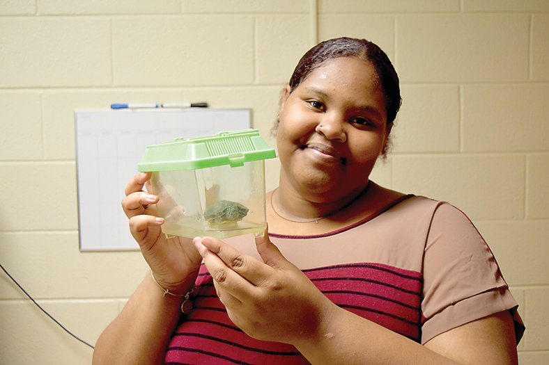 Arianna Taylor, from Edison, New Jersey, with Michelangelo, her turtle. Photograph courtesy of Delaware Valley University.