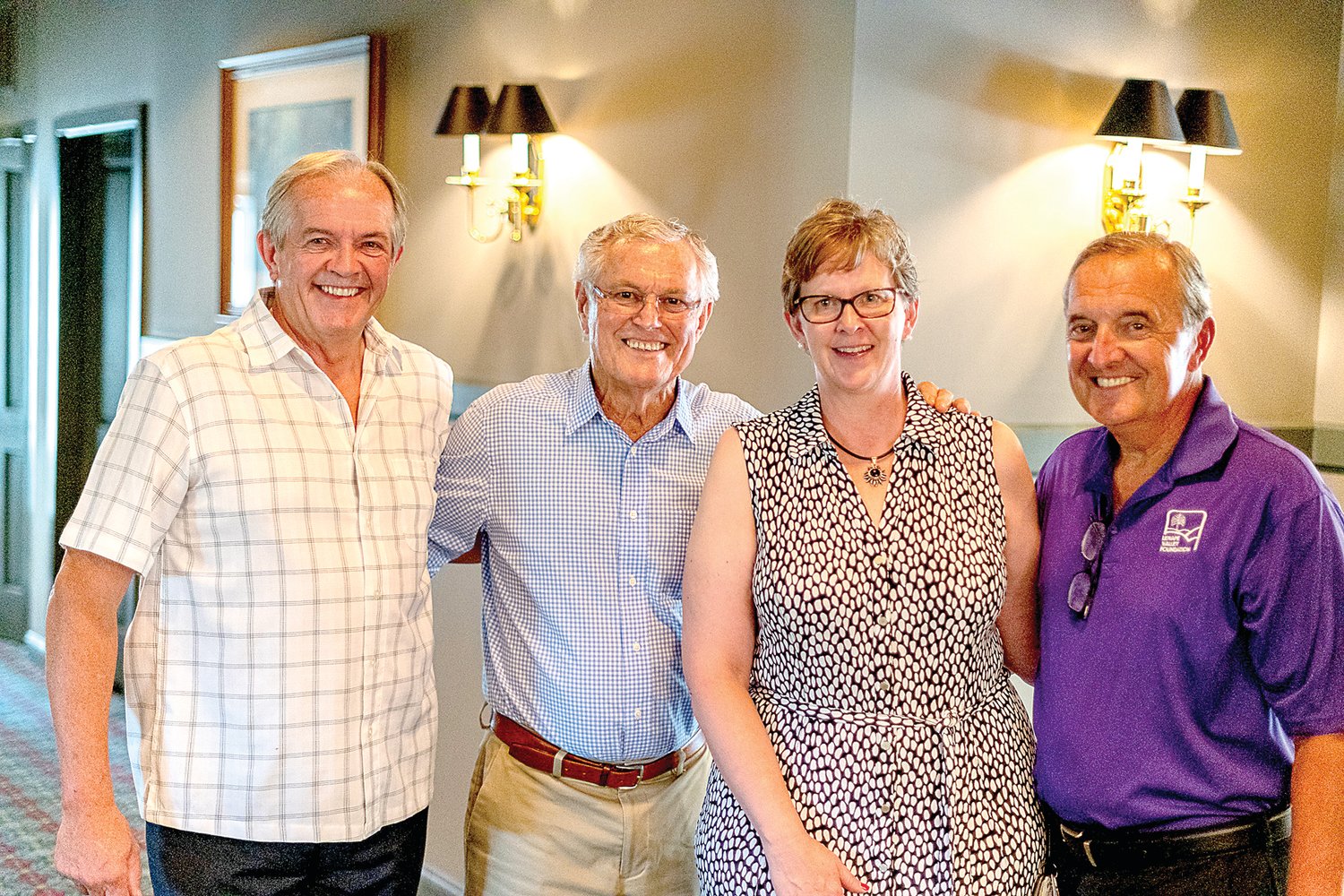 Doylestown Mayor Ron Strouse, the emcee for the evening; former Philadelphia Eagles coach Dick Vermeil, Sharon Curran, Lenape Valley Foundation CEO; and Robert Rogala, Lenape Valley Foundation board president/golf chairperson. Photograph by Chris Markley.