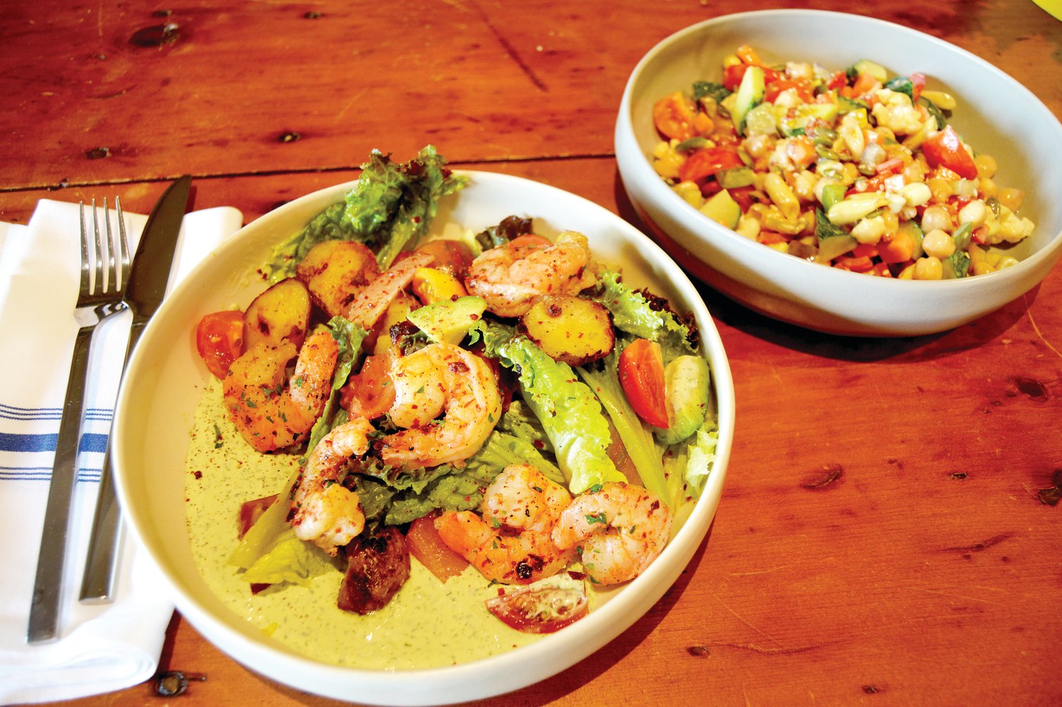 Shrimp, left, and chopped salads are on the menu at the snack bar at Poppy’s Greengrocer.