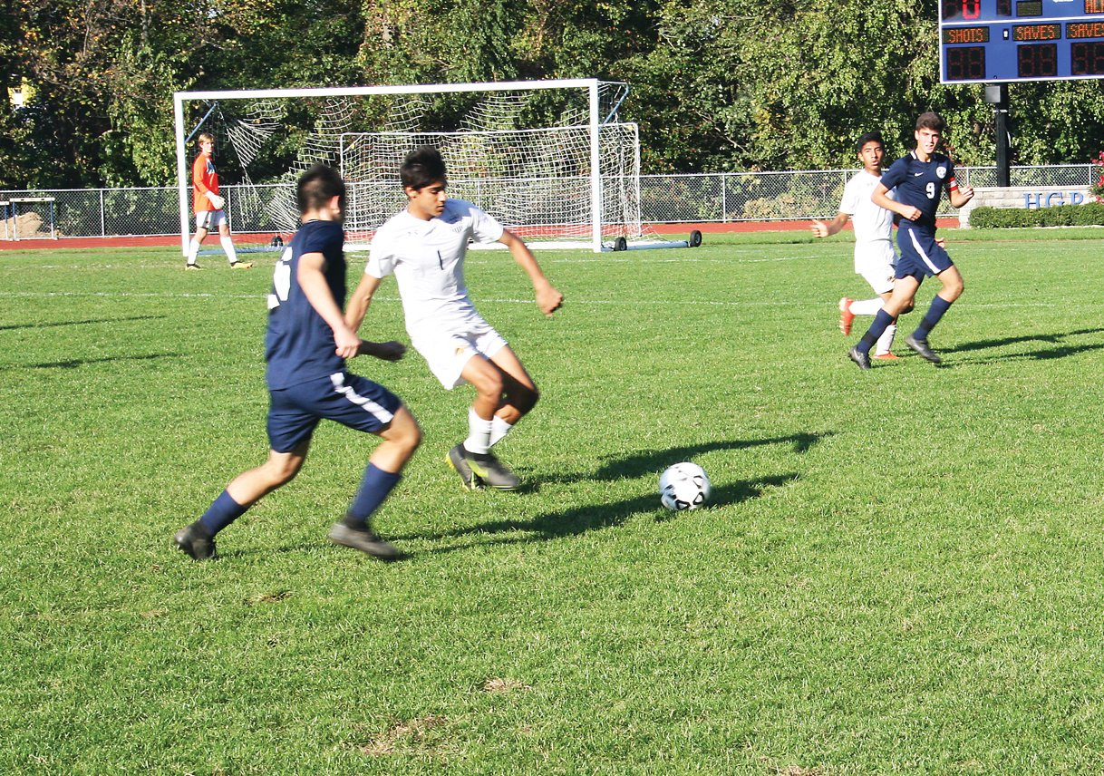 New Hope’s Akhil Castelli goes for the ball.  Photograph by Don Leypoldt.