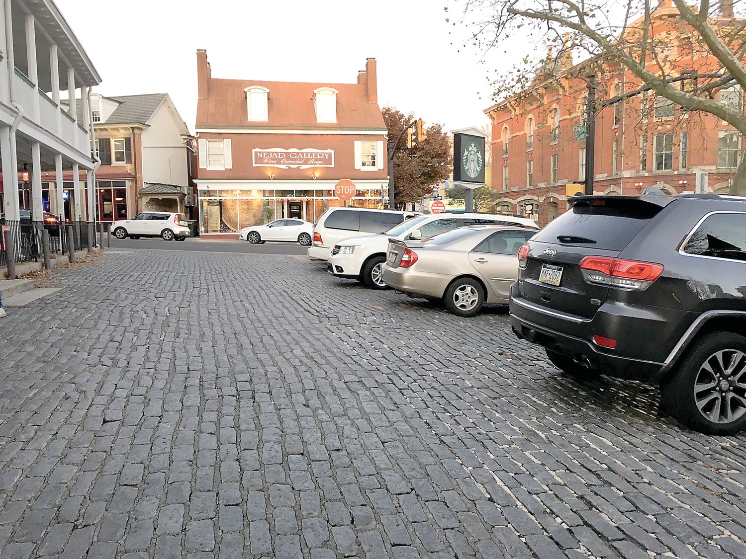 Belgian blocks line the parking area in front of the Doylestown Starbucks, once the Fountain House inn. A proposal would turn the area into a park.
