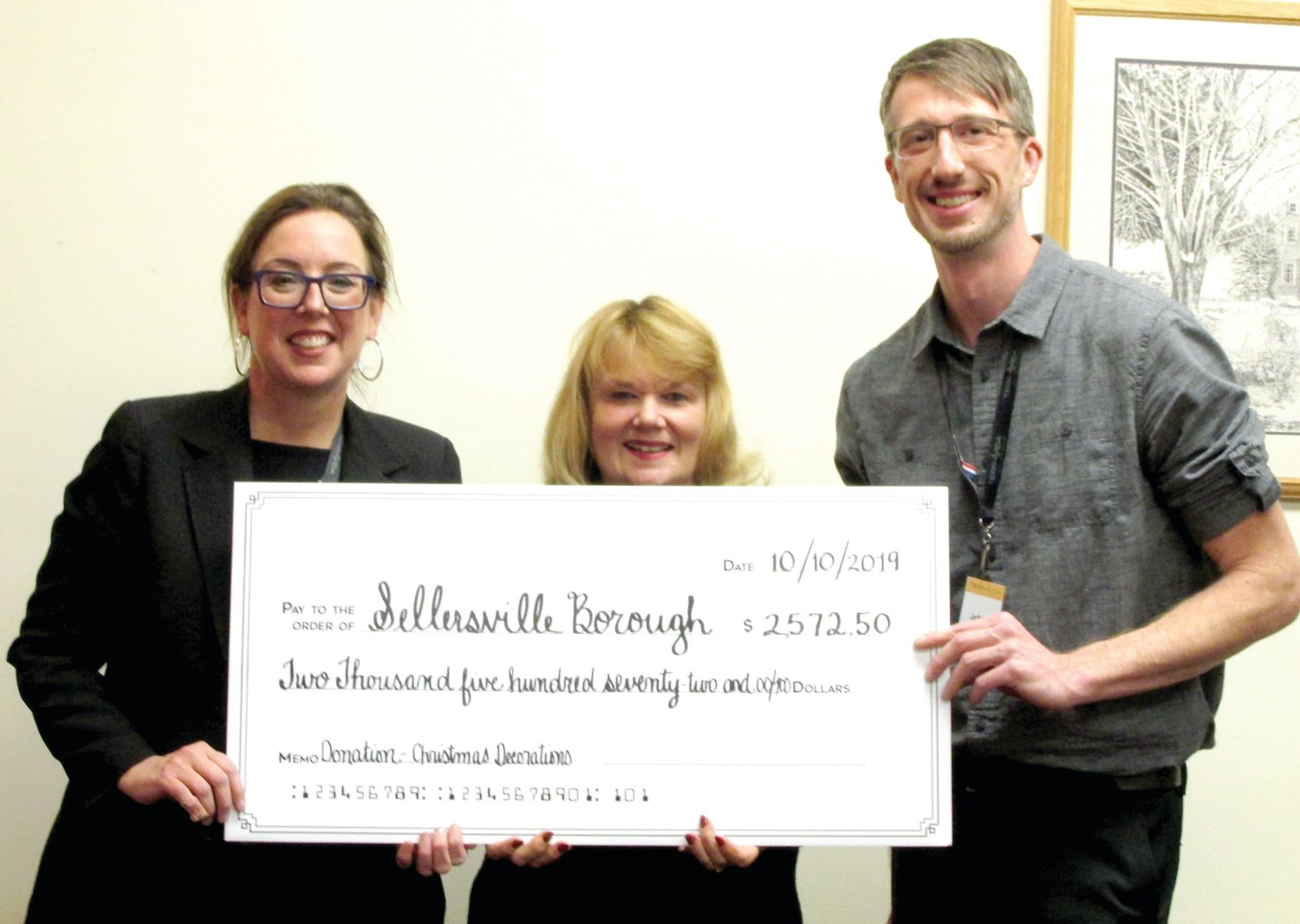 TerraVida’s Jeff Melhuish and Cathie Cashman present a donation check to Sellersville Borough Council President Lois Dodson.