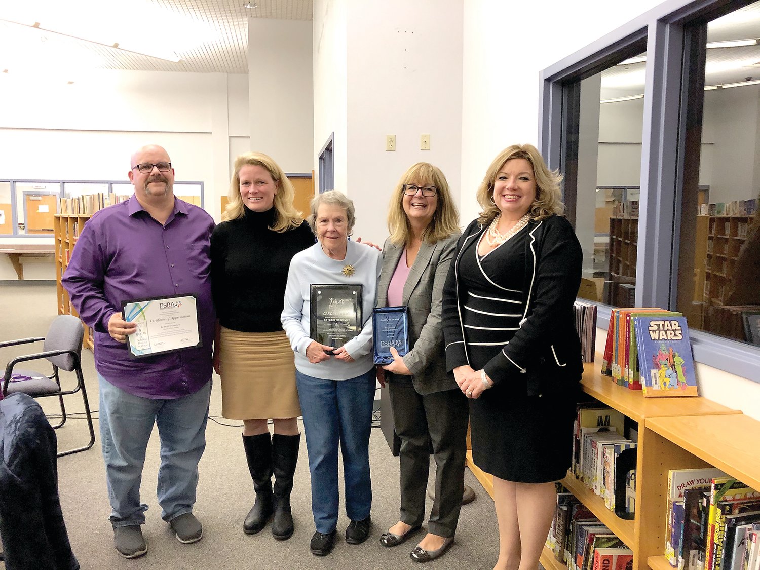 Palisades School Board President Bob Musantry, Dr. Bridget O’Connell; Karen Devine, and Rebecca Roberts-Malamis were among presenters honoring Carol Clemens, center, at the Nov. 6 public board meeting for her 32 years of service on the school board and 28 years for the Bucks County Intermediate Unit.