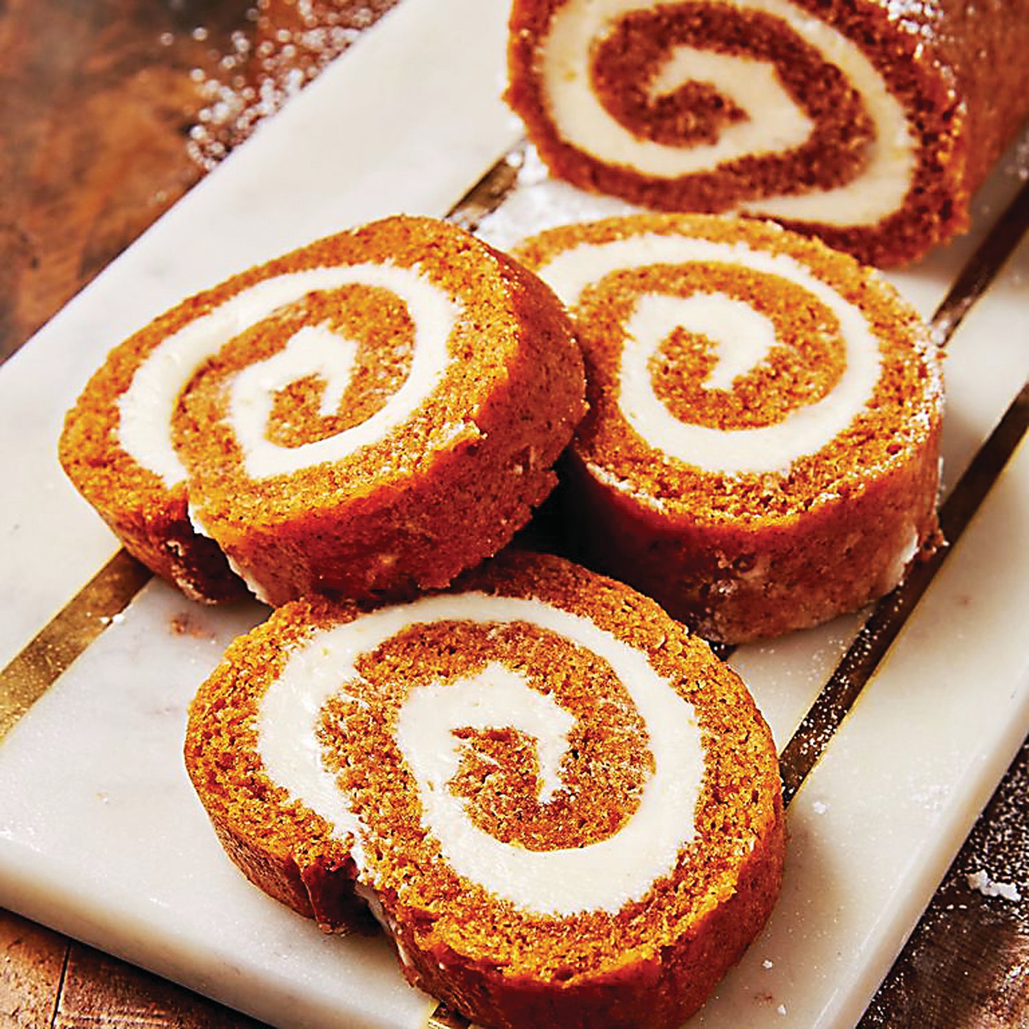 Now is the time to plan for Thanksgiving dinner, whether you are calling a turkey hotline or making a dessert like this Pumpkin Cheesecake Roll. Photograph by delish.com