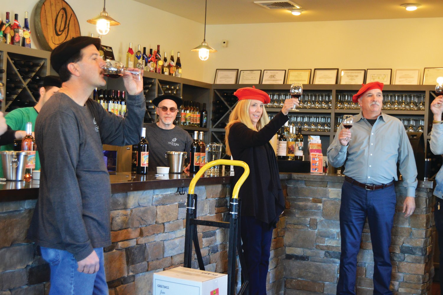Staff at Old York Cellars in Ringoes, N.J., raise glasses of the vineyard’s first Beajoulais noveau-style wines during wine release festivities. Photograph by Susan S. Yeske