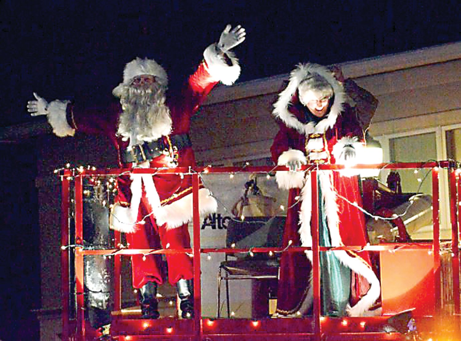Santa and Mrs. Claus wave to the crowd.
