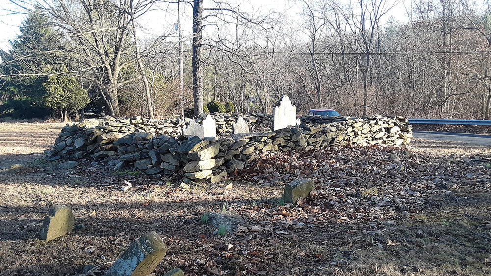 Crews will remove three trees that border Gallows Hill cemetery on Dec. 10, temporarily closing a section of Gallows Hill between Hunter Road and Route 412. The historic commission fears some of the graves will be exposed if the trees come down by natural means. Photograph by Barrie-John Murphy.
