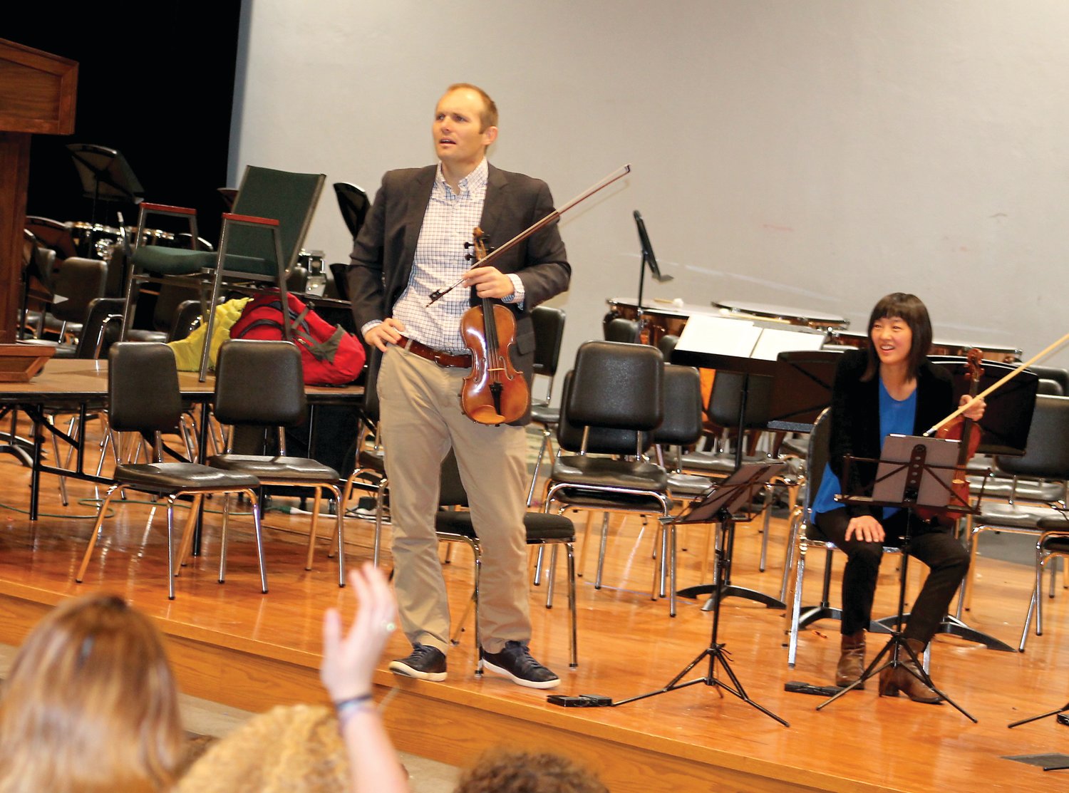 Violinists J. Freivogel and Karen Kim answer questions from students following the Jasper String Quartet’s morning performance at Holcong Middle School Dec. 5.