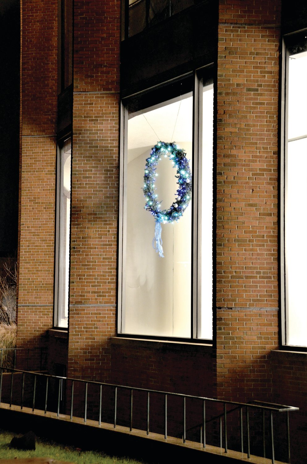 The Blue Light Memorial Wreath hangs in a ground-floor window at the Bucks County Administration Building in Doylestown.