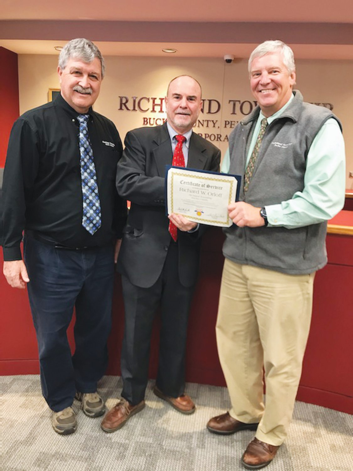 Richland Township Supervisor Rick Orloff received a certificate of appreciation from the Pennsylvania State Association of Township Supervisors (PSATS) honoring his 24 years of service as a supervisor. From left are xxxx Botson, Orloff and Paul Sepanoff at the Dec. 9 public supervisors meeting. Orloff did not seek reelection for a fifth term. Photograph by Cliff Lebowitz.